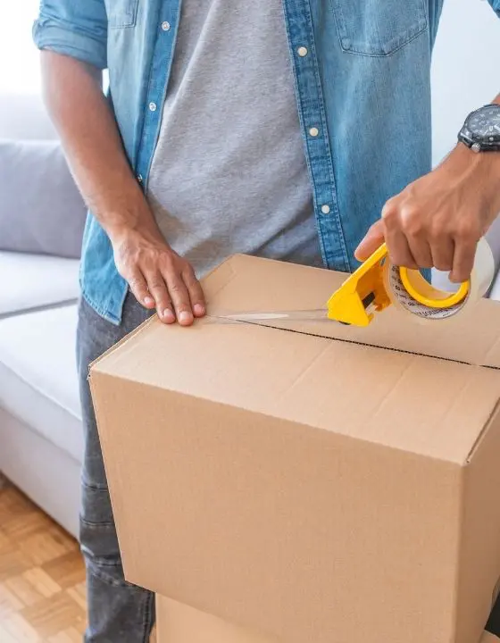 Customer taping up a free Storage Chorlton packing box