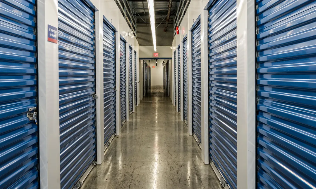 Corridor of blue self storage units